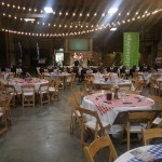 Gingham tablecloths and party lights dress up the auction barn!